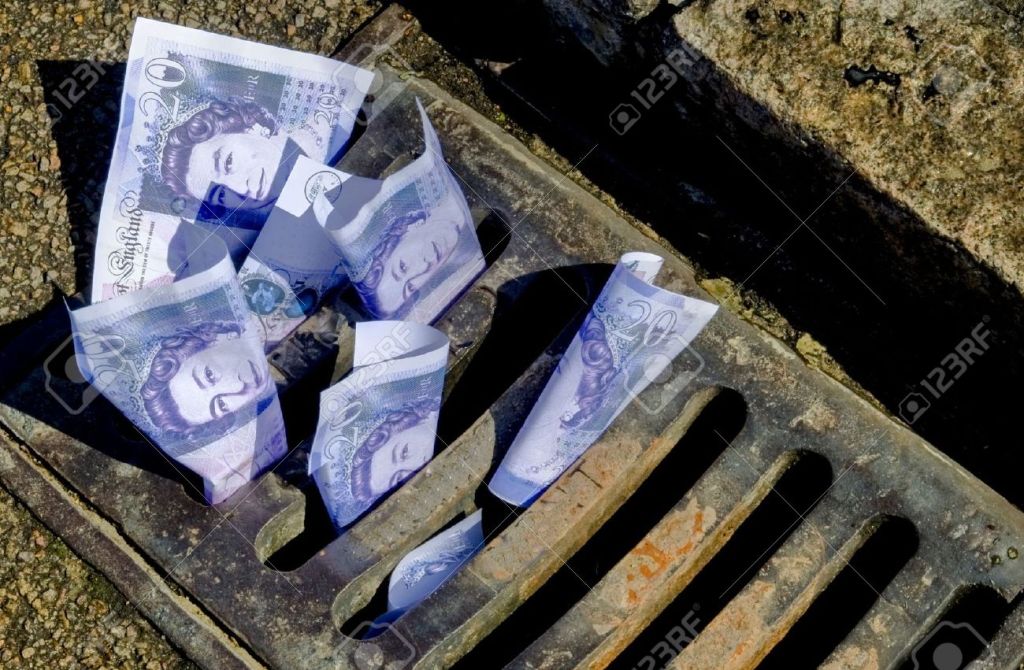 Money being put down the drain. Image symbolises how I lost or through money down the drain.